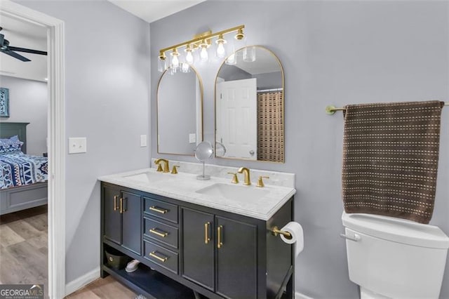 333 Ivy Hills Cir, Mount Airy, GA 30563 - full bath featuring connected bathroom, double vanity, ceiling fan, and wood finished floors