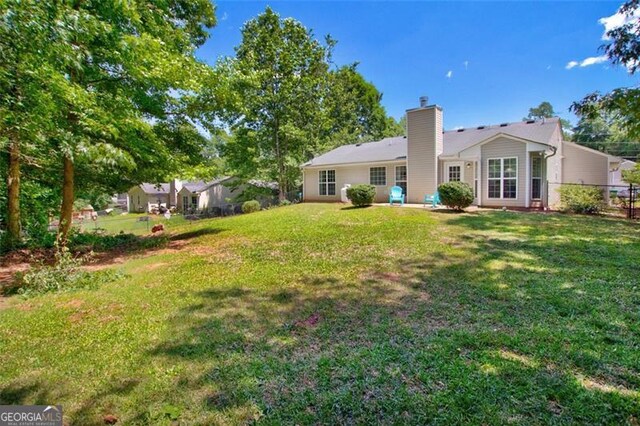 333 Ivy Hills Cir, Mount Airy, GA 30563 - back of property featuring a chimney