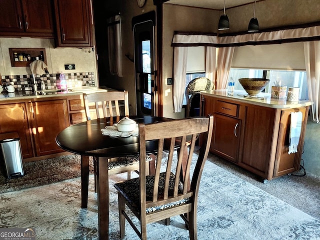 16 Dutchman Way, Cleveland, GA 30528 - kitchen featuring light countertops, decorative backsplash, decorative light fixtures, and a center island