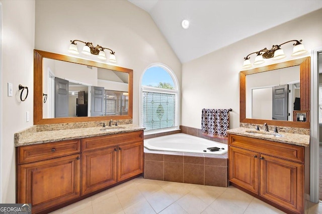 161 Highgrove Dr, Suwanee, GA 30024 - full bath featuring two vanities, a garden tub, tile patterned flooring, and high vaulted ceiling