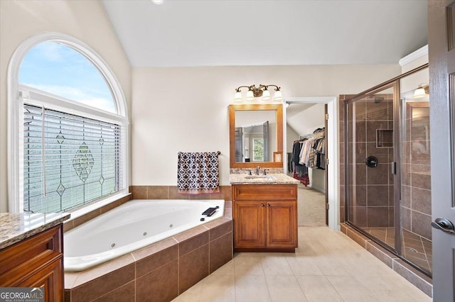 161 Highgrove Dr, Suwanee, GA 30024 - bathroom with vanity, a stall shower, a jetted tub, and tile patterned flooring