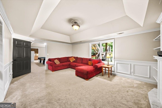 161 Highgrove Dr, Suwanee, GA 30024 - living area featuring a raised ceiling, carpet, a decorative wall, wainscoting, and crown molding