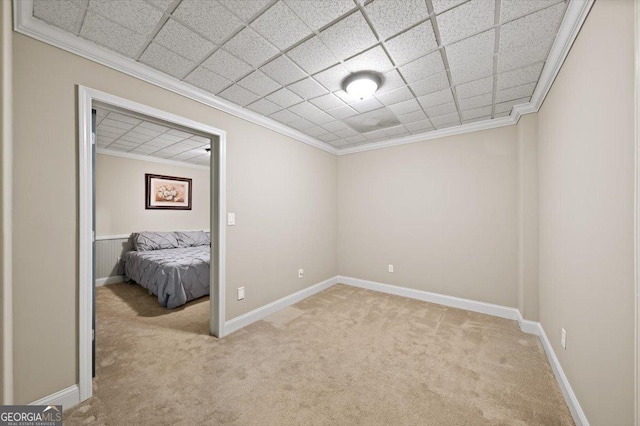 161 Highgrove Dr, Suwanee, GA 30024 - unfurnished bedroom featuring light colored carpet, crown molding, baseboards, and a paneled ceiling