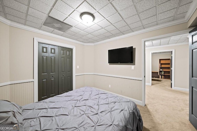 161 Highgrove Dr, Suwanee, GA 30024 - carpeted bedroom with wainscoting, a closet, and ornamental molding