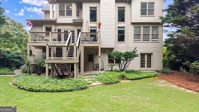 161 Highgrove Dr, Suwanee, GA 30024 - back of property featuring stairway, a lawn, a wooden deck, and a patio