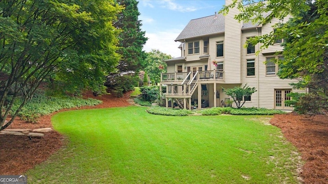 161 Highgrove Dr, Suwanee, GA 30024 - back of house with a lawn, stairs, a deck, and a chimney