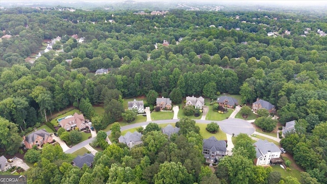 161 Highgrove Dr, Suwanee, GA 30024 - aerial view of property and surrounding area featuring nearby suburban area and a heavily wooded area