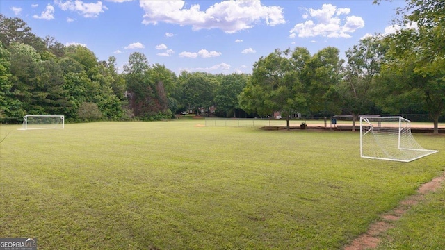 161 Highgrove Dr, Suwanee, GA 30024 - view of yard with an area for sports and a wooded view