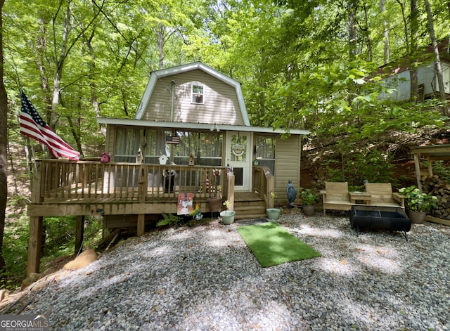 87 Garden Ln, Cleveland, GA 30528 - back of house featuring a gambrel roof, a deck, and a wooded view