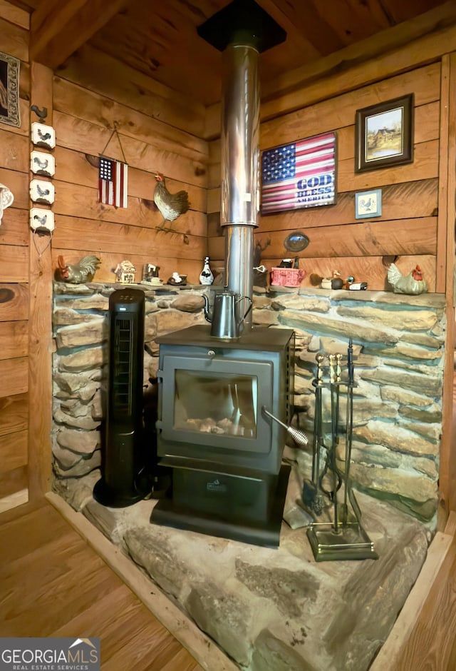 87 Garden Ln, Cleveland, GA 30528 - detailed view of a wood stove, wooden walls, and wood finished floors