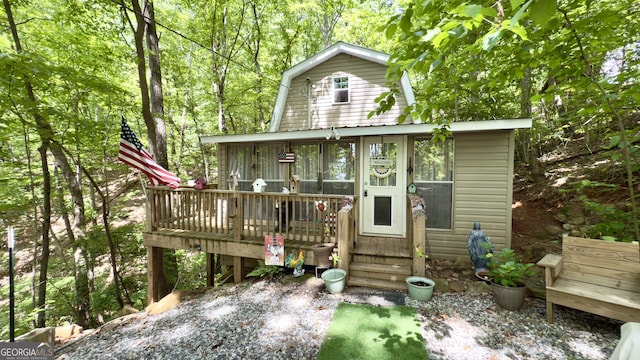 87 Garden Ln, Cleveland, GA 30528 - rear view of house featuring a deck and a gambrel roof