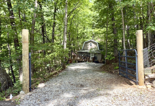87 Garden Ln, Cleveland, GA 30528 - gate featuring a forest view and an outbuilding