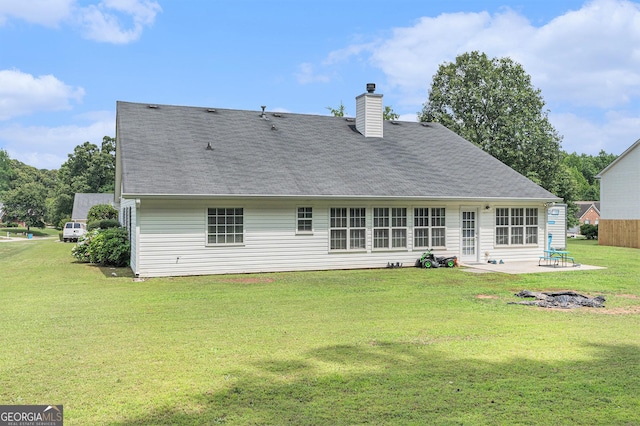 1108 The By Way, Mcdonough, GA 30252 - back of property featuring a patio, a yard, and a chimney