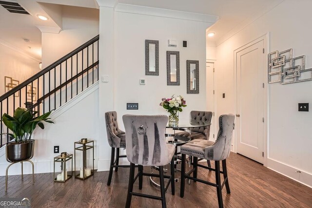 2543 Oakbourne Ln Unit 14, Smyrna, GA 30080 - dining room with wood finished floors, ornamental molding, stairs, and baseboards