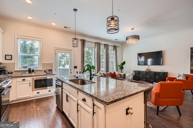 2543 Oakbourne Ln Unit 14, Smyrna, GA 30080 - kitchen with a sink, appliances with stainless steel finishes, dark wood finished floors, dark stone counters, and recessed lighting