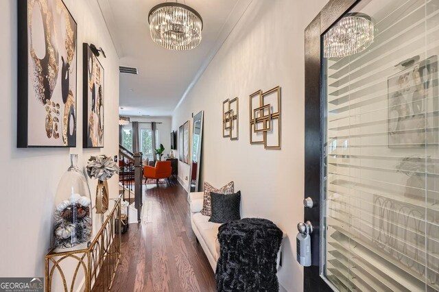 2543 Oakbourne Ln Unit 14, Smyrna, GA 30080 - corridor featuring a chandelier, dark wood finished floors, and crown molding