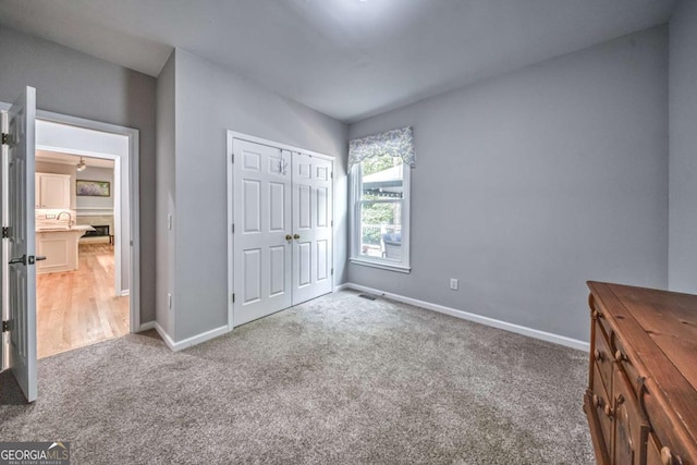 1325 Starboard Way, Cumming, GA 30041 - unfurnished bedroom featuring carpet flooring, baseboards, and a closet