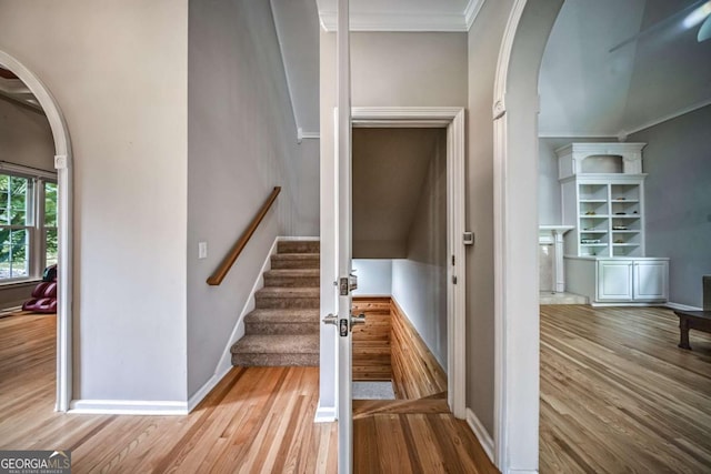 1325 Starboard Way, Cumming, GA 30041 - stairway with arched walkways, wood finished floors, ornamental molding, and baseboards