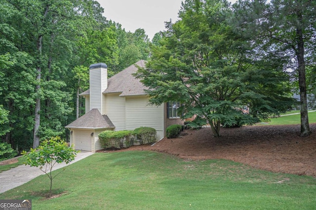 1325 Starboard Way, Cumming, GA 30041 - view of side of home featuring a yard, driveway, a chimney, and roof with shingles