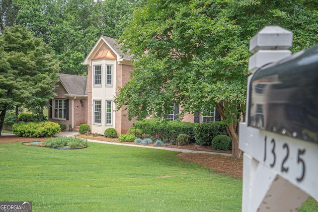 1325 Starboard Way, Cumming, GA 30041 - view of front facade with a front lawn, brick siding, and roof with shingles
