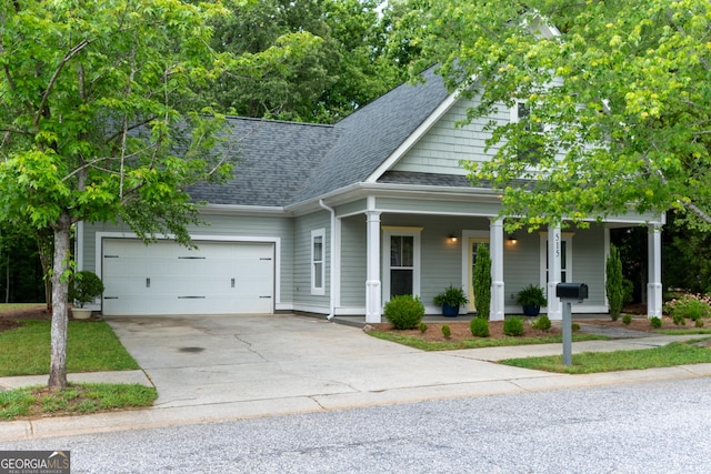 515 Edgewood Dr, Athens, GA 30606 - view of front of house featuring roof with shingles, an attached garage, concrete driveway, and a porch