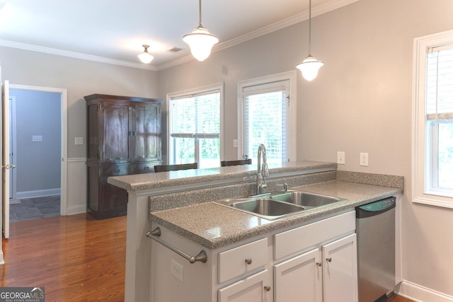 515 Edgewood Dr, Athens, GA 30606 - kitchen featuring dishwasher, a sink, dark wood-style floors, pendant lighting, and crown molding