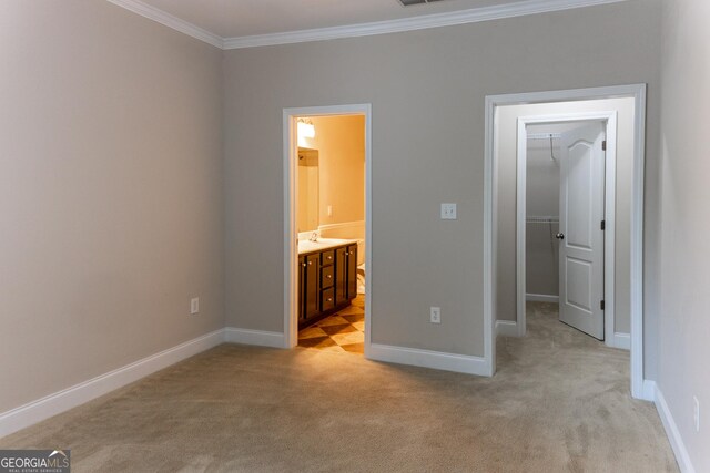 515 Edgewood Dr, Athens, GA 30606 - unfurnished bedroom with light carpet, a walk in closet, ornamental molding, baseboards, and ensuite bath