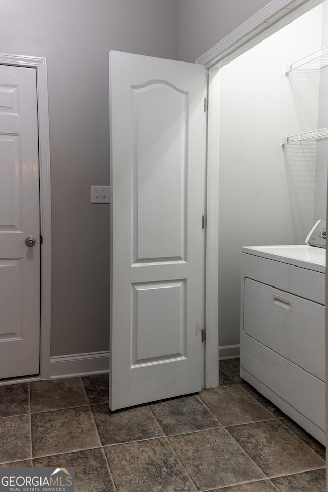 515 Edgewood Dr, Athens, GA 30606 - washroom with washer / dryer, stone tile floors, and baseboards