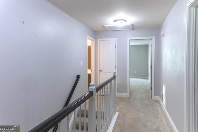 515 Edgewood Dr, Athens, GA 30606 - hallway with an upstairs landing, light colored carpet, attic access, and baseboards