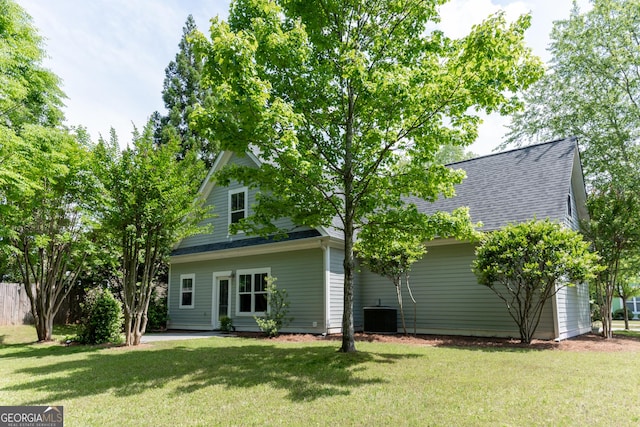 515 Edgewood Dr, Athens, GA 30606 - back of house featuring central air condition unit, a yard, and a shingled roof