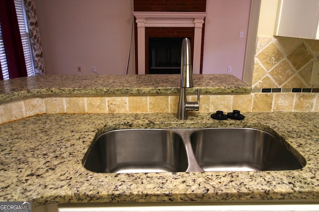 7976 Big Creek Pl, Columbus, GA 31904 - kitchen featuring light stone countertops and decorative backsplash