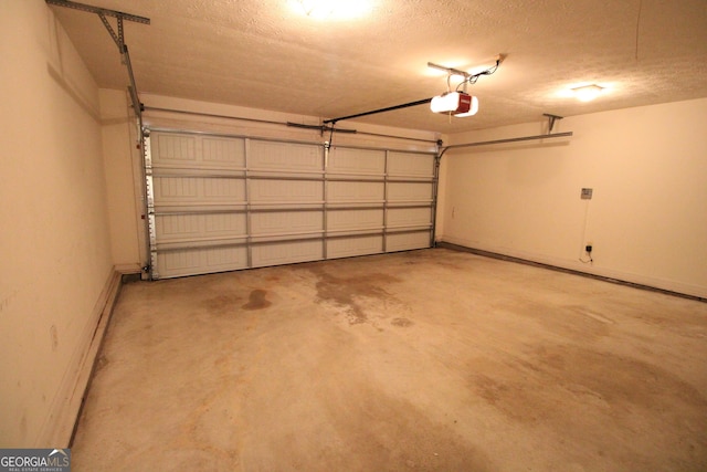 7976 Big Creek Pl, Columbus, GA 31904 - garage featuring a garage door opener and baseboards