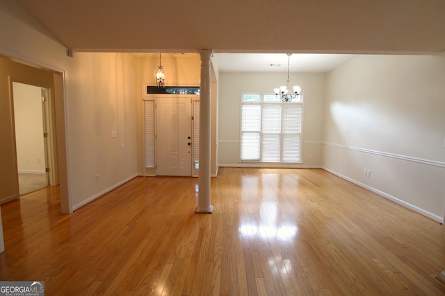 7976 Big Creek Pl, Columbus, GA 31904 - unfurnished dining area with a chandelier, baseboards, and light wood finished floors