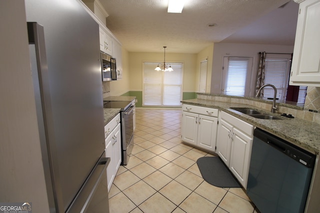 7976 Big Creek Pl, Columbus, GA 31904 - kitchen featuring stainless steel appliances, white cabinets, a peninsula, a chandelier, and a textured ceiling