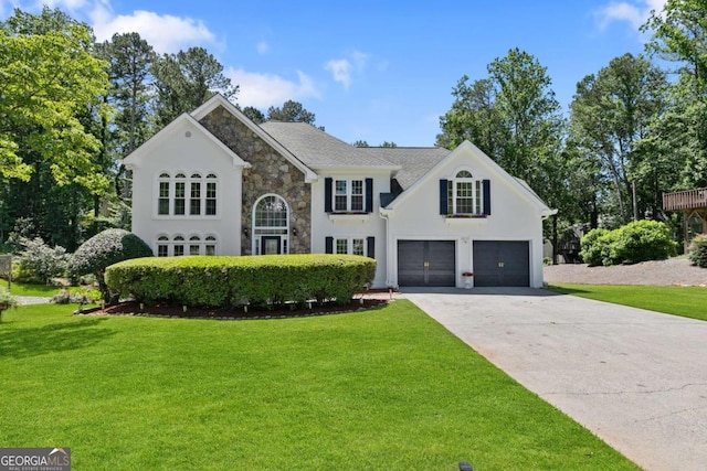 5706 Brookstone Walk NW, Acworth, GA 30101 - view of front facade featuring stone siding, concrete driveway, a front yard, and an attached garage