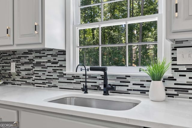 5706 Brookstone Walk NW, Acworth, GA 30101 - kitchen featuring decorative backsplash and white cabinetry