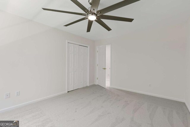 5706 Brookstone Walk NW, Acworth, GA 30101 - unfurnished bedroom with carpet floors, ceiling fan, and a closet