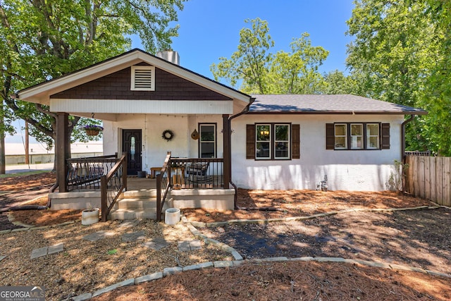 73 Fair St, Newnan, GA 30263 - view of front of home with a porch, stucco siding, and a shingled roof