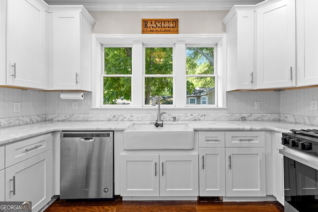 73 Fair St, Newnan, GA 30263 - kitchen featuring appliances with stainless steel finishes, a sink, tasteful backsplash, white cabinets, and crown molding