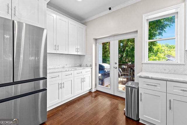73 Fair St, Newnan, GA 30263 - kitchen with freestanding refrigerator, french doors, crown molding, and plenty of natural light