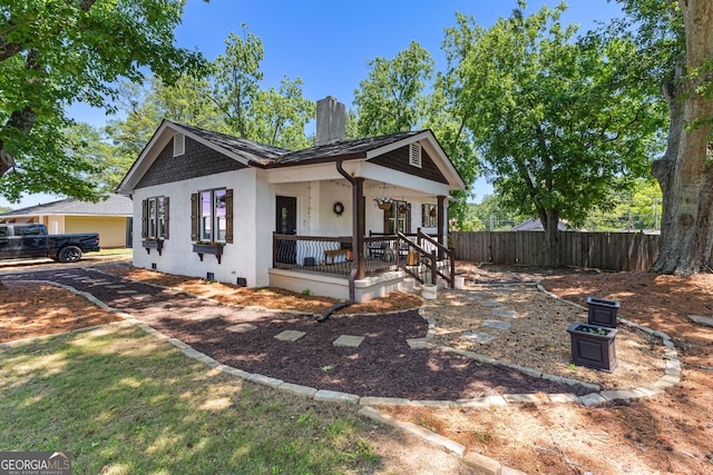 73 Fair St, Newnan, GA 30263 - view of front of property with a chimney, covered porch, crawl space, and stucco siding