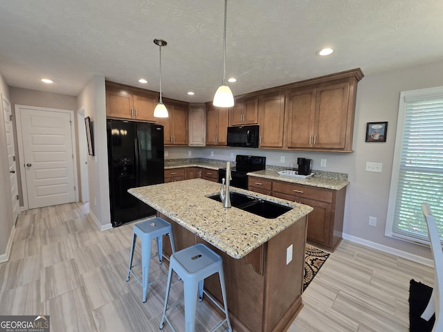 1356 Woodbrier, Sautee Nacoochee, GA 30571 - kitchen with black appliances, baseboards, brown cabinets, a breakfast bar area, and recessed lighting