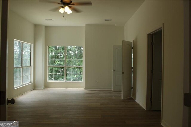 4220 Glad Morning Dr, College Park, GA 30349 - spare room with ceiling fan, wood finished floors, plenty of natural light, and baseboards