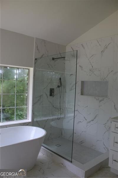 4220 Glad Morning Dr, College Park, GA 30349 - bathroom featuring marble finish floors, a marble finish shower, a freestanding bath, vanity, and lofted ceiling