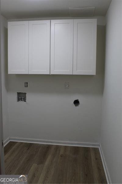 4220 Glad Morning Dr, College Park, GA 30349 - laundry room featuring hookup for a washing machine, dark wood-type flooring, and cabinet space