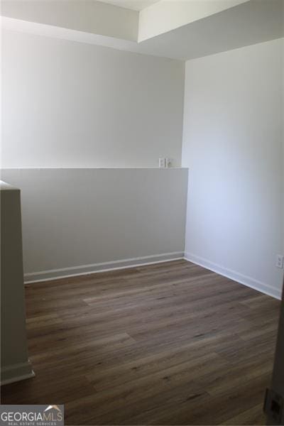 4220 Glad Morning Dr, College Park, GA 30349 - spare room with dark wood-style floors and baseboards