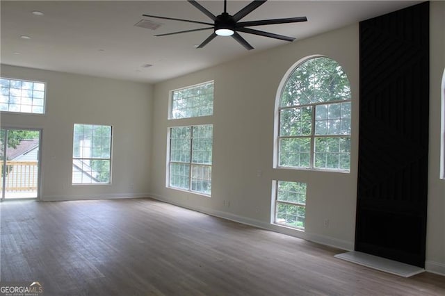 4220 Glad Morning Dr, College Park, GA 30349 - spare room with wood finished floors, a ceiling fan, and baseboards