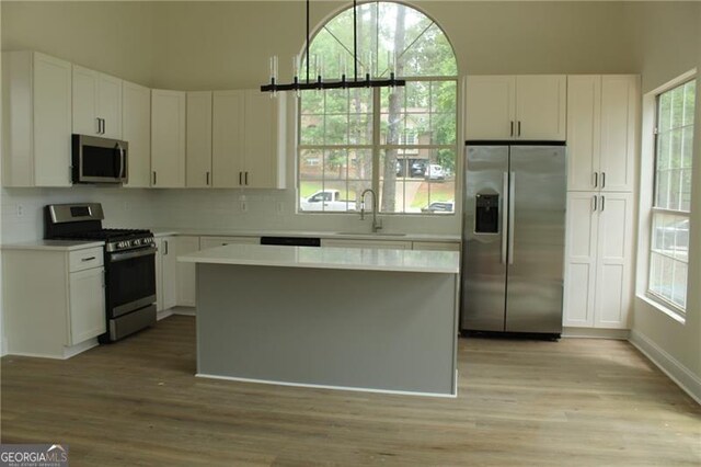 4220 Glad Morning Dr, College Park, GA 30349 - kitchen featuring stainless steel appliances, a sink, light countertops, and white cabinets