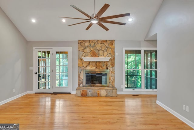 112 White Oak Cir, Dublin, GA 31021 - unfurnished living room with vaulted ceiling, ceiling fan, wood finished floors, a fireplace, and baseboards