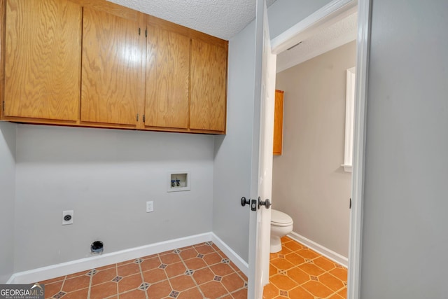 112 White Oak Cir, Dublin, GA 31021 - washroom with hookup for a washing machine, electric dryer hookup, a textured ceiling, cabinet space, and baseboards